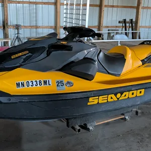 2023 Sea-Doo GTR personal watercraft. Features a Rotax engine, yellow and black color scheme, and Minnesota registration MN 0338 ML (expires 2025). HI
