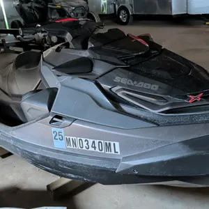 2023 Sea-Doo personal watercraft. Features a black and gray hull with red accents, a contoured operator seat, and a textured rear deck. Registration: 