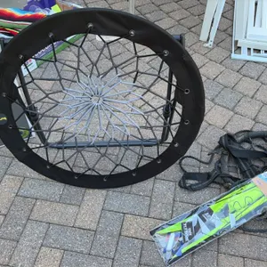 Outdoor lifestyle package lot. Includes a Belavi glass bird bath with metal stand in original box, a round folding bungee web chair, a 'Ready 2 Fly' k