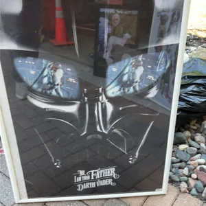 Collection of framed posters and wall decor. Includes (3) 25" x 37" framed posters featuring Star Wars Darth Vader, Minions, and Keith Kimberlin puppi