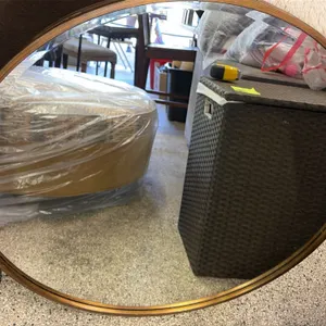 Home utility and decor lot. Includes a 34" round wall mirror with a gold-tone frame, a 57"H folding floor mirror in a dark-finished frame, and a foldi