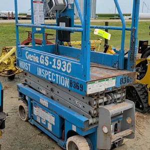 1999 Genie GS-1930 electric scissor lift. Features a 500 lbs capacity, platform extension, solid non-marking tires, and platform control box. Hour met