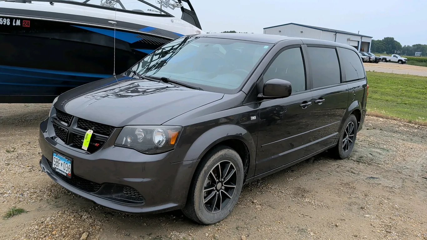 2014 Dodge Grand Caravan 30th Anniversary Edition passenger minivan. Features a 3.6L VVT V6 engine, automatic transmission, Stow 'n Go rear seating, a