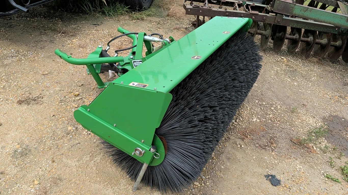 2018 John Deere 1400/1500 60" Broom heavy-duty rotary broom attachment. Features 60" clearing width, poly bristles, hydraulic angling cylinder, mechan