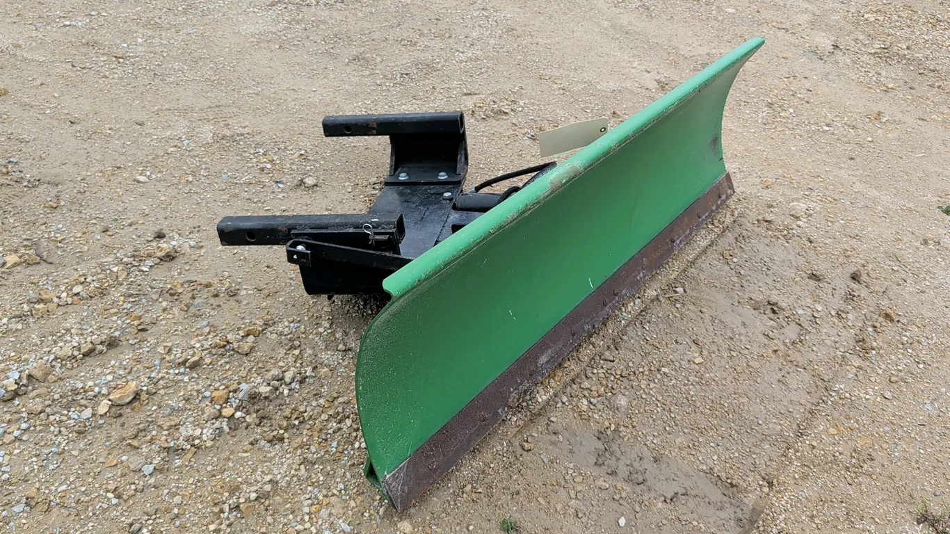 2019 John Deere 60" Front Blade. Heavy-duty blade designed to mount to a John Deere 1585 power unit. Features hydraulic angling cylinder with hoses, f