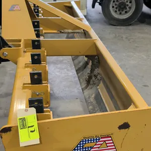 Everything Attachments 3-point box blade. Features adjustable scarifier shanks and dual cutting edges. 8'L. 3-point hitch mount. Tractor in background