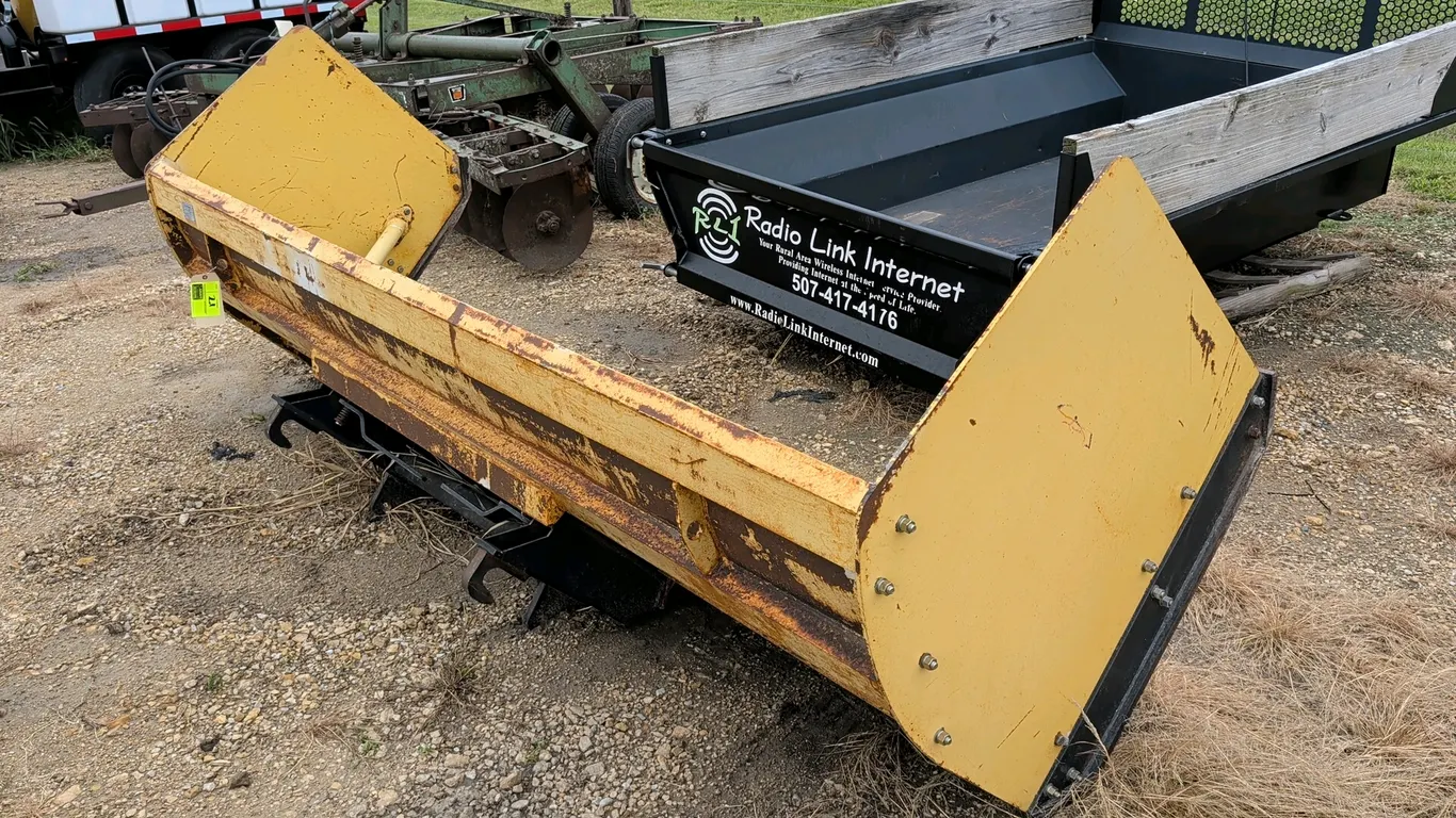 2018 Titan Attachments SP10 snow pusher. Features a curved steel moldboard, side support braces, side plates, and a rubber cutting edge. Equipped with