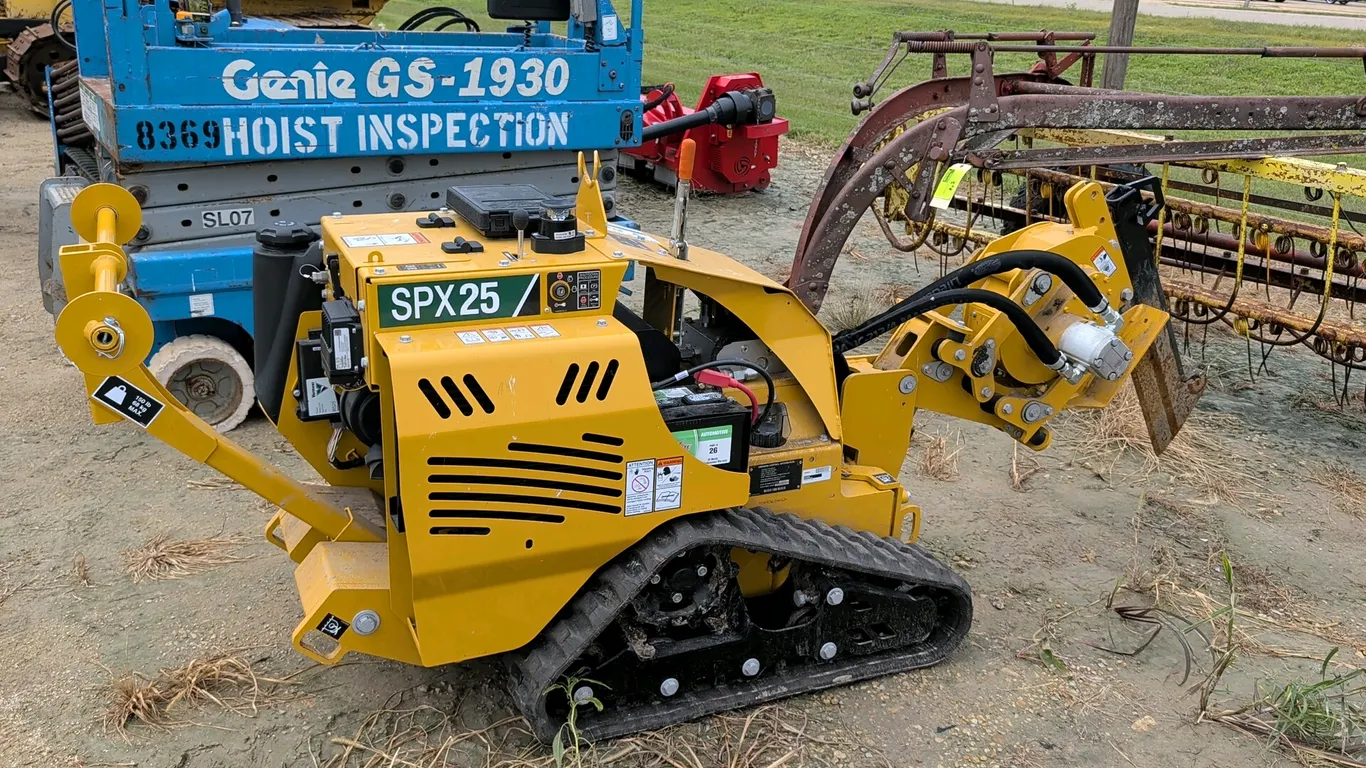 2021 Vermeer SPX25 vibratory plow. Features a rubber track drive system, front-mounted vibratory plow assembly, and a rear-mounted reel carrier. Power