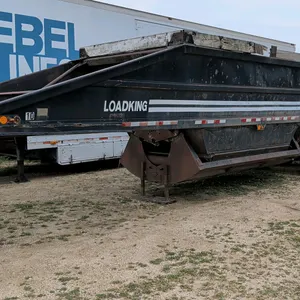 1983 Loadking belly dump gravel trailer. Features triple-axle configuration, bottom discharge gate with pneumatic cylinder, leaf spring suspension, an