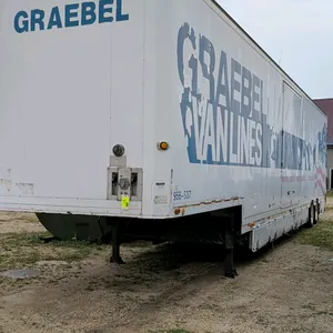 1992 Kentucky moving van trailer. Features multiple side access doors, lower storage compartments, rear swing doors, and interior cargo control tracks