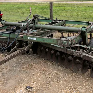 Oliver 242 tandem disc harrow. Features a 14' working width, pull-type hitch, and hydraulic lift with cylinder and hoses. Equipped with transport whee