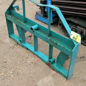 Quick attach pallet fork carriage frame. Features green painted steel construction with dual top mounting hooks and bottom pin receivers. Includes sli