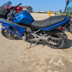 Kawasaki Ninja 650R motorcycle. Features a blue finish, liquid-cooled engine, chain drive, dual front disc brakes, and a two-up seat. Instrument clust