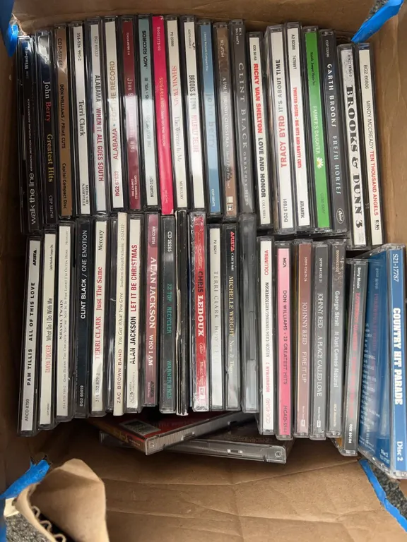 Box Lot of Country Music CDs Featuring Hit Artists