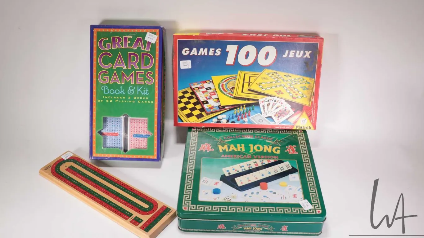 Four assorted games including American version Mah Jong, Great Card games book kit, box of 100 games