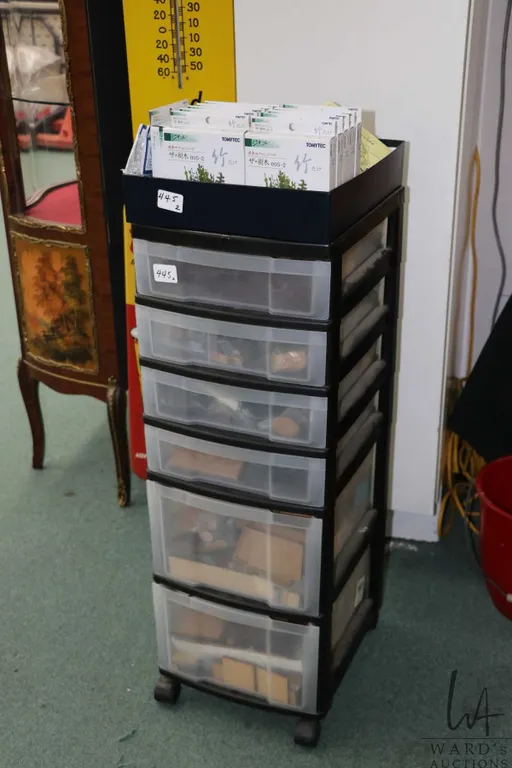 Six drawer rolling storage cart and contents including laser cut wooden gaming bases and magnetic ba