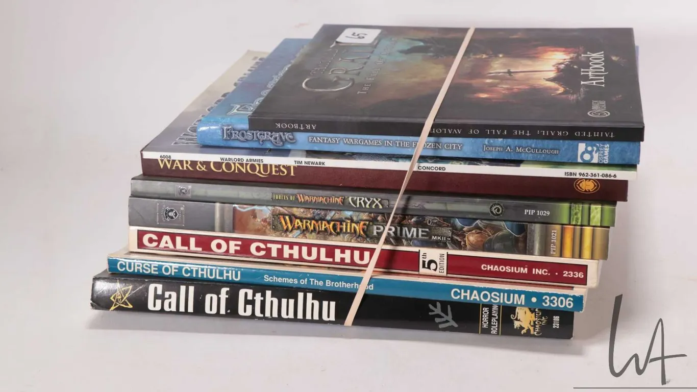 Selection of miniature gaming rule and companion books including "Tainted Grail-The Fall of Avalon",
