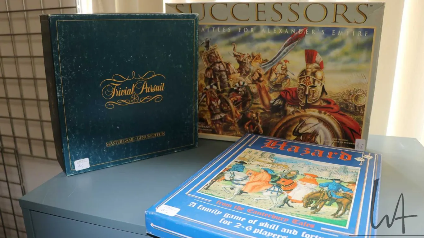 Three board games including " Hazard-from the Cantebrbury Tales", "Trivial Pursuit" and "Successor-