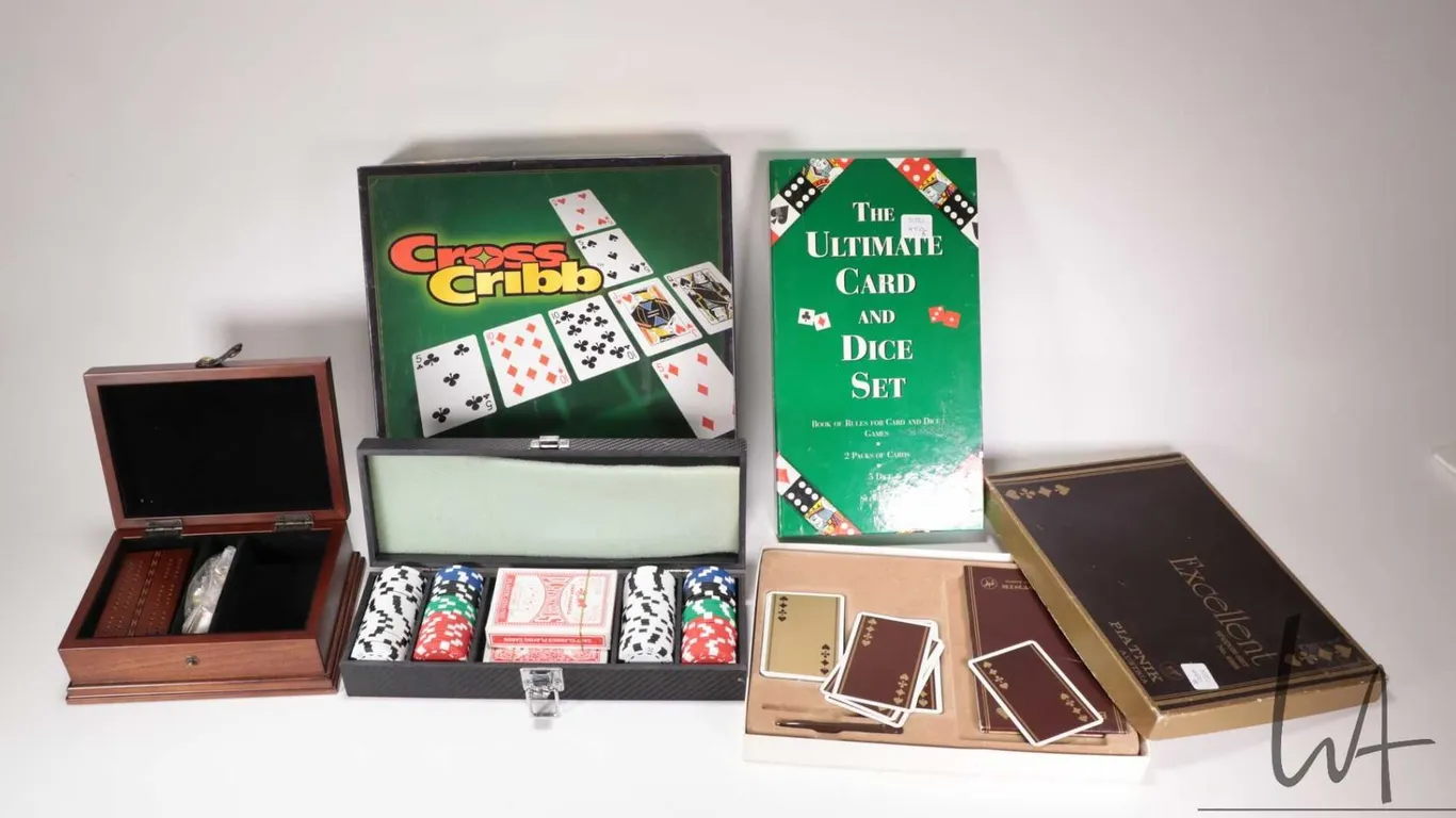 Four games including Cross Crib, Excellent crib set, The Ultimate Card and Dice set and an Encana po