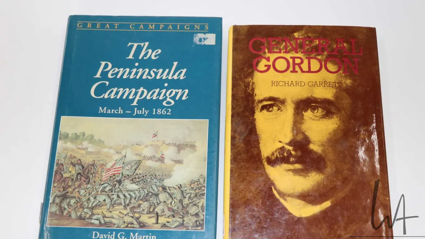 Two hardcover books including "General Gordon" by Richard Garrett and "Great Campaigns: The Peninsul