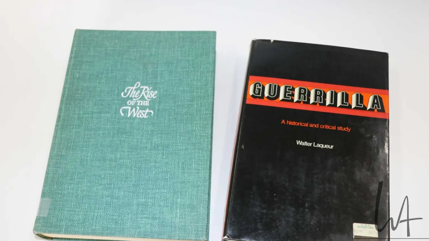 Two hardcover books incuding "The Rise of the West" by William H. McNeill and "Guerilla: A Historica