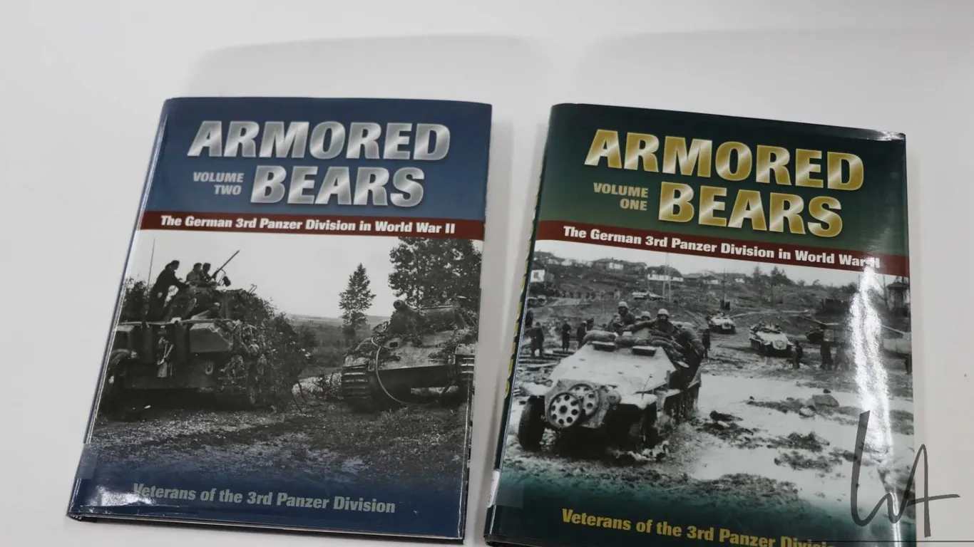 Two hardcover books including "Italian Naval Camouflage of World War II" by Marco Ghiglino and "The