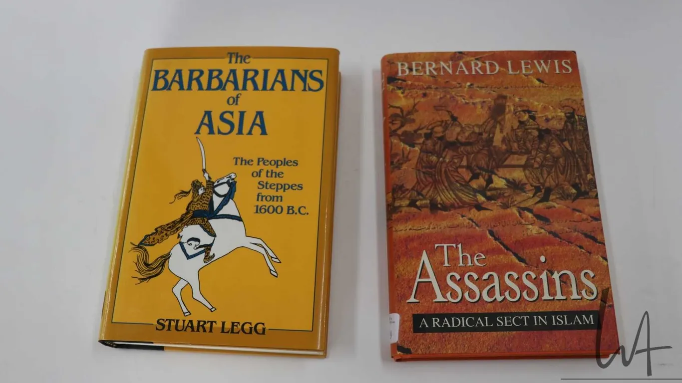 Two hardcover books including "The Assassins: A Radical Sect in Islam" by Bernard Lewis and "The Bar