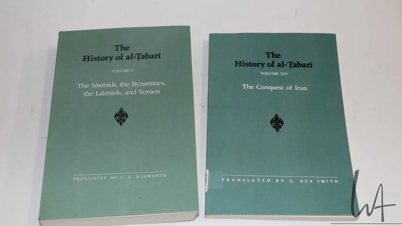 Two softcover books including "The History of al-Tabari: Vol. V The Sasanids, the Byzantines, the La