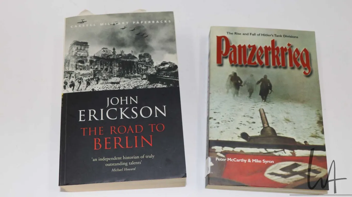 Two softcover books including "Panzerkrieg: The Rise and Fall of Hitler's Tank Division" by Peter Mc
