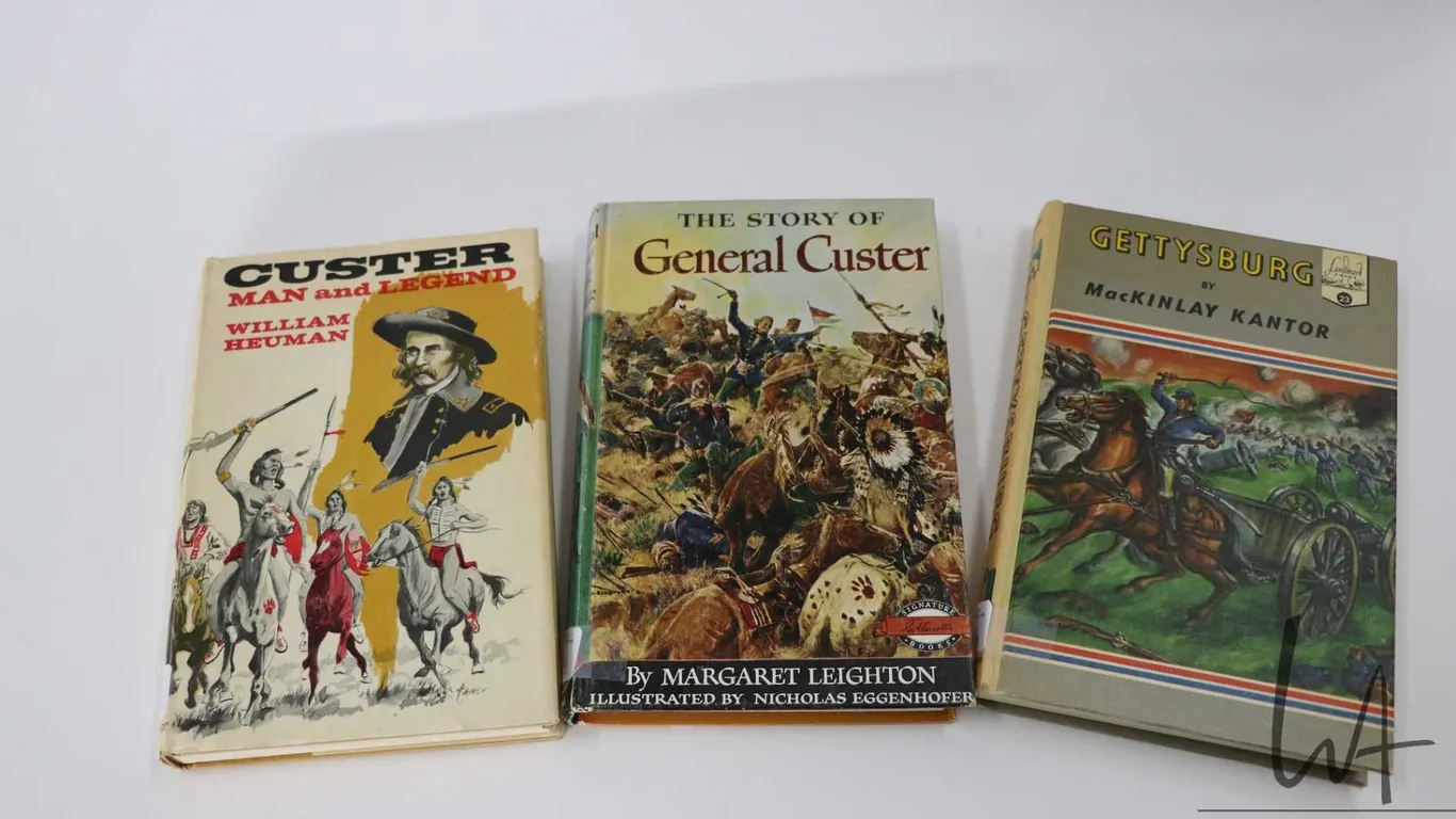 Three hardcover books including "Custer: Man and Legend" by William Heuman, " The Story of General C