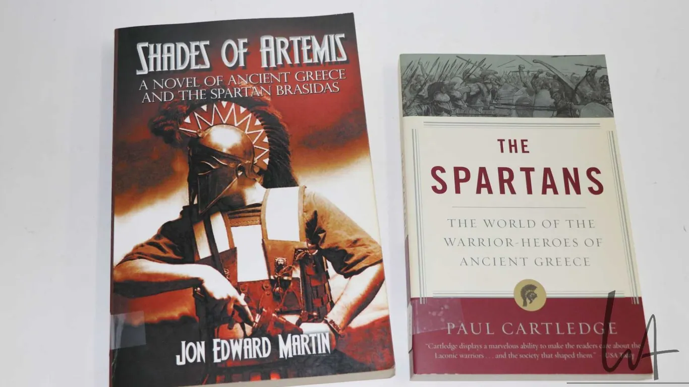 Two softcover books including " The Spartans: The World of the Warrior-Heroes of Ancient Greece" by