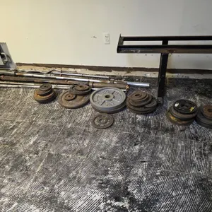 (#43) Assorted Weight Plates and Metal Storage Rack