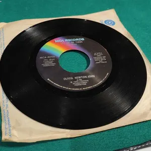 Olivia Newton-John – 45 "Let Me Be There / Maybe Then I’ll Think of You"