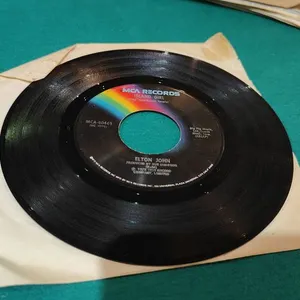 Elton John – 45 "Island Girl / Sugar on the Floor"