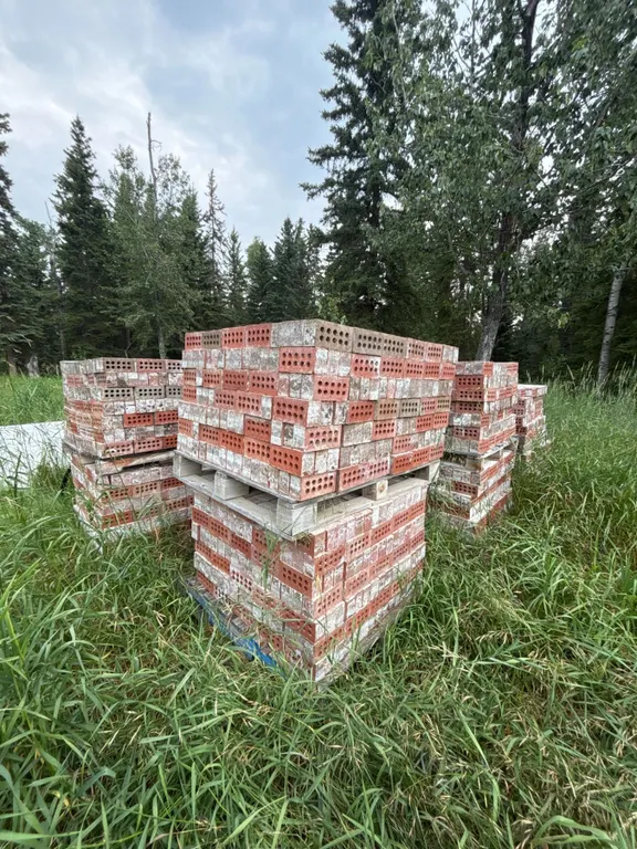 12 Pallets of Red and White Perforated Bricks