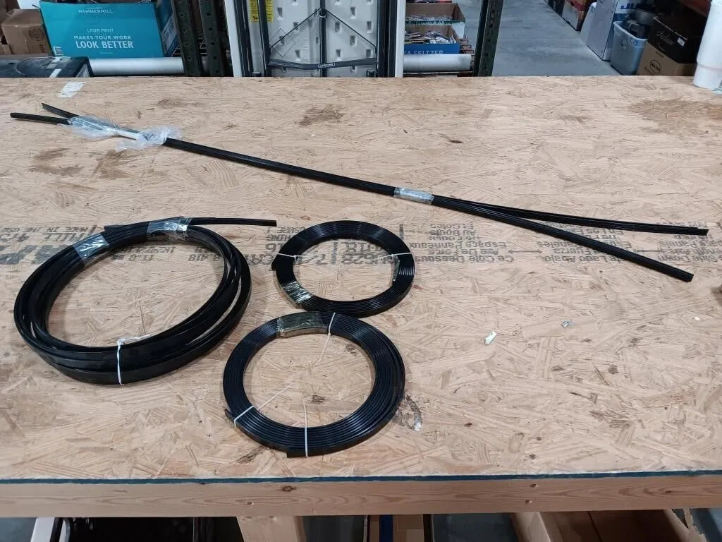 Three rolls of rigid plastic stripping and four
