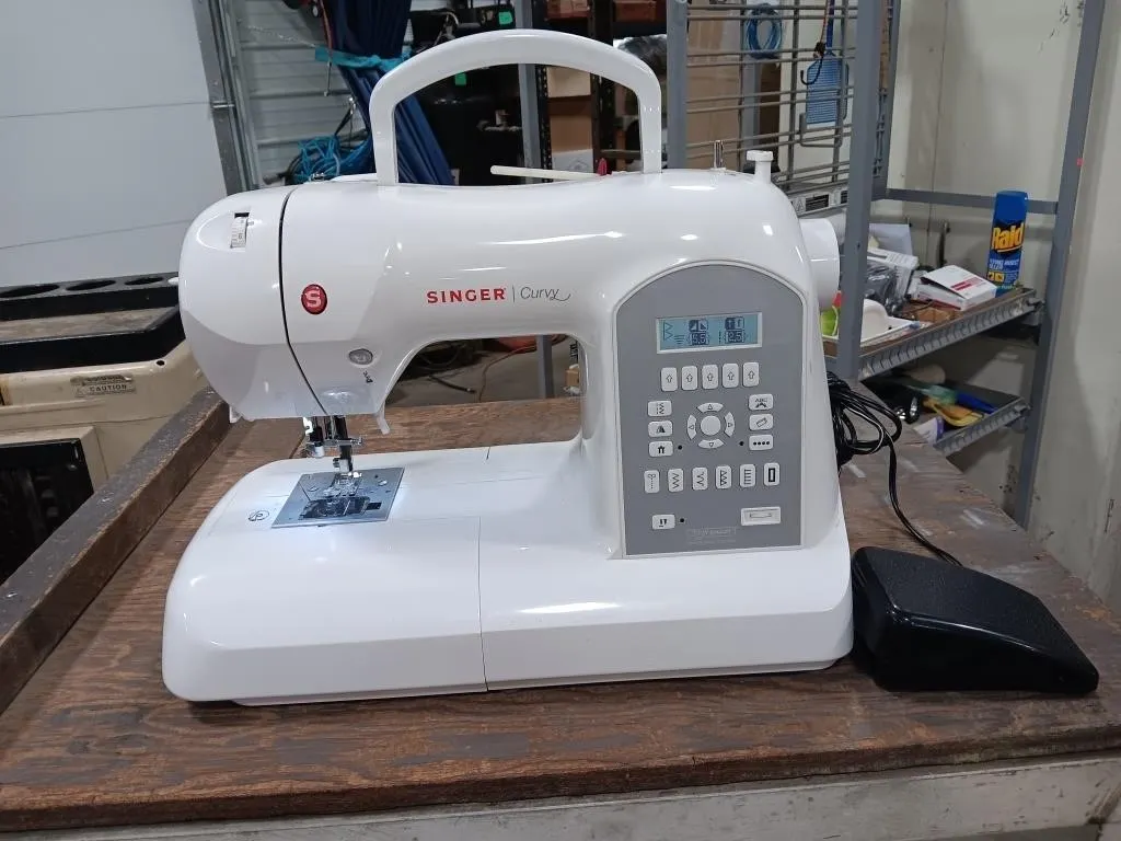 Singer Curvy Sewing Machine. Turned On At Lotting