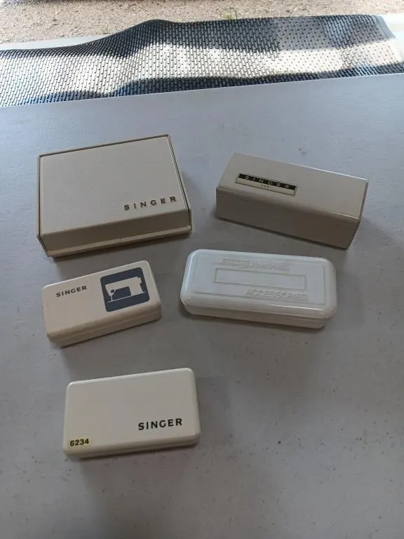 Vintage Singer sewing machine accessory boxes