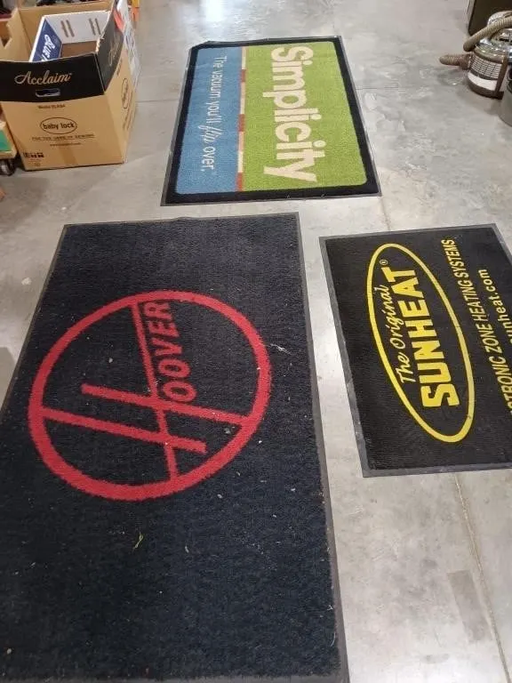 Three carpeted rubber mats approximately 58x34,