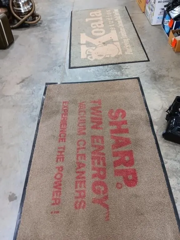 Two carpeted rubber mats approximately 59x36 &