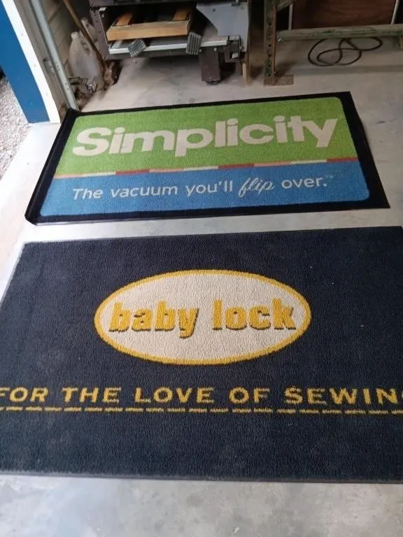 Two carpeted rubber mats approximately 57x33