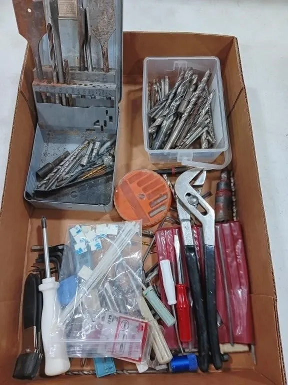 Assortment of tools and hardware
Drill