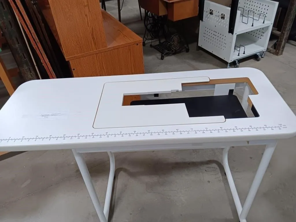 Janome machine cabinet approximately 45x18x30, e1