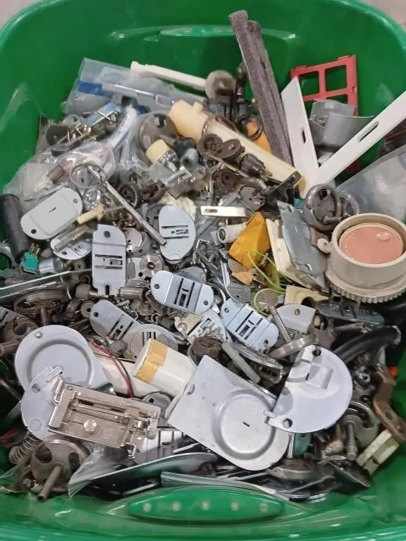 Assortment of sewing machine parts and pieces