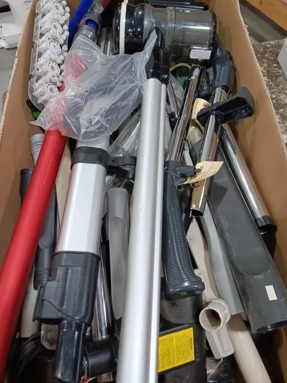 Assortment of vacuum tubes, crevice tools, heads