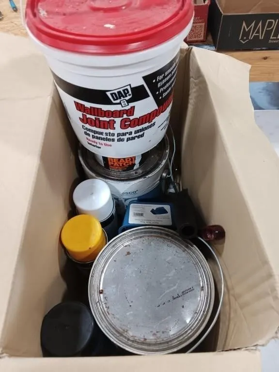 Box of paints and home repair items
(No Shipping