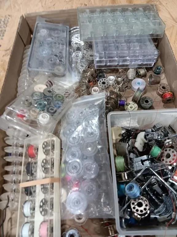 Assortment of bobbins, plastic & metal