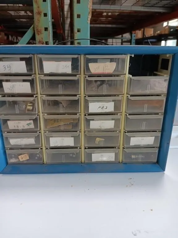 24 drawer metal storage, 1 plastic bin missing