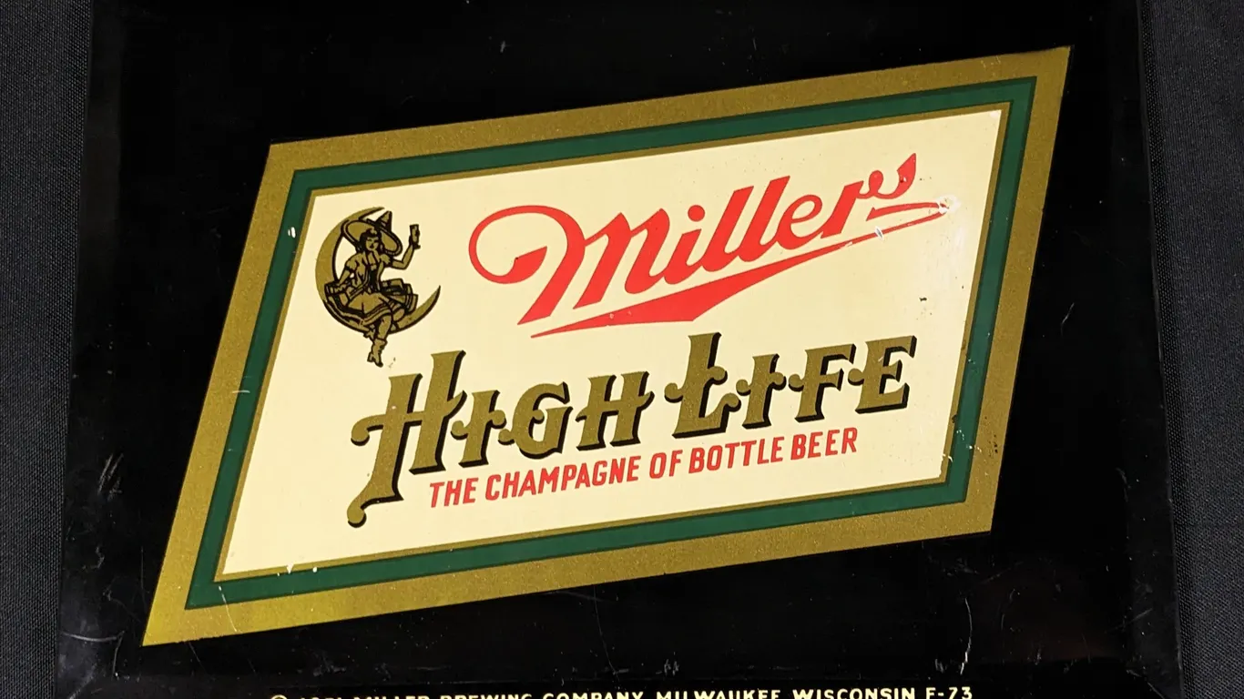TOC TIN SIGN MILLER HIGH LIFE THE CHAMPAGNE OF BOTTLED BEER