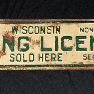 EMBOSSED TIN SIGN WISCONSIN FISHING LICENSES SOLD HERE RES $1.00 NON RES $4.00
